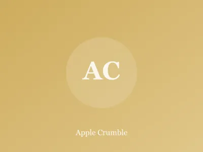 Dish of apple crumble with golden oat topping and a serving spoon