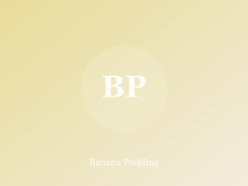 Glass dish of banana pudding with layers of custard, banana slices and vanilla wafers
