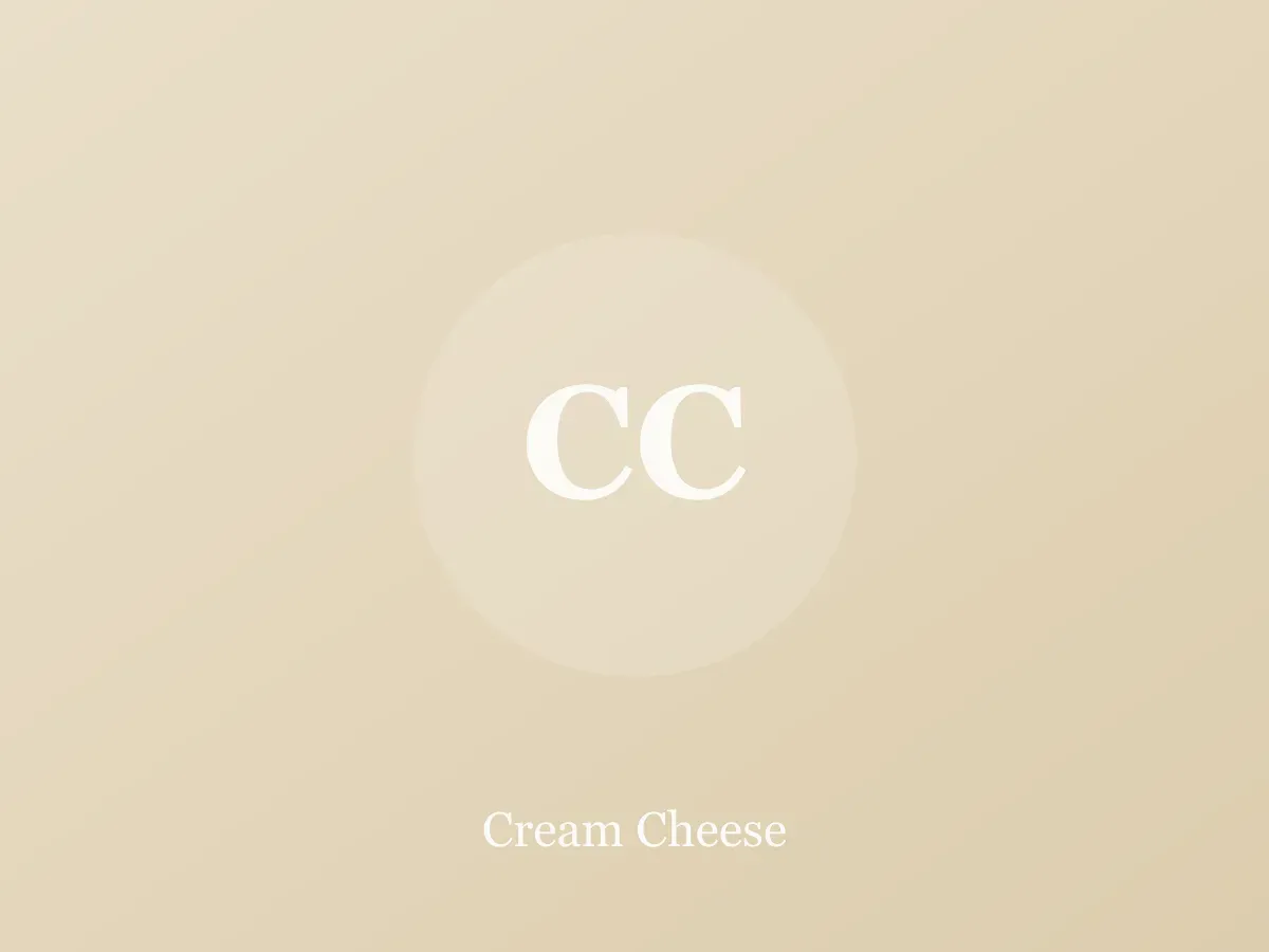 Block of cream cheese on parchment with a knife