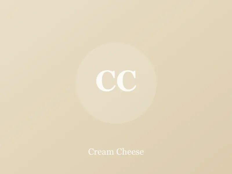 Block of cream cheese on parchment with a knife