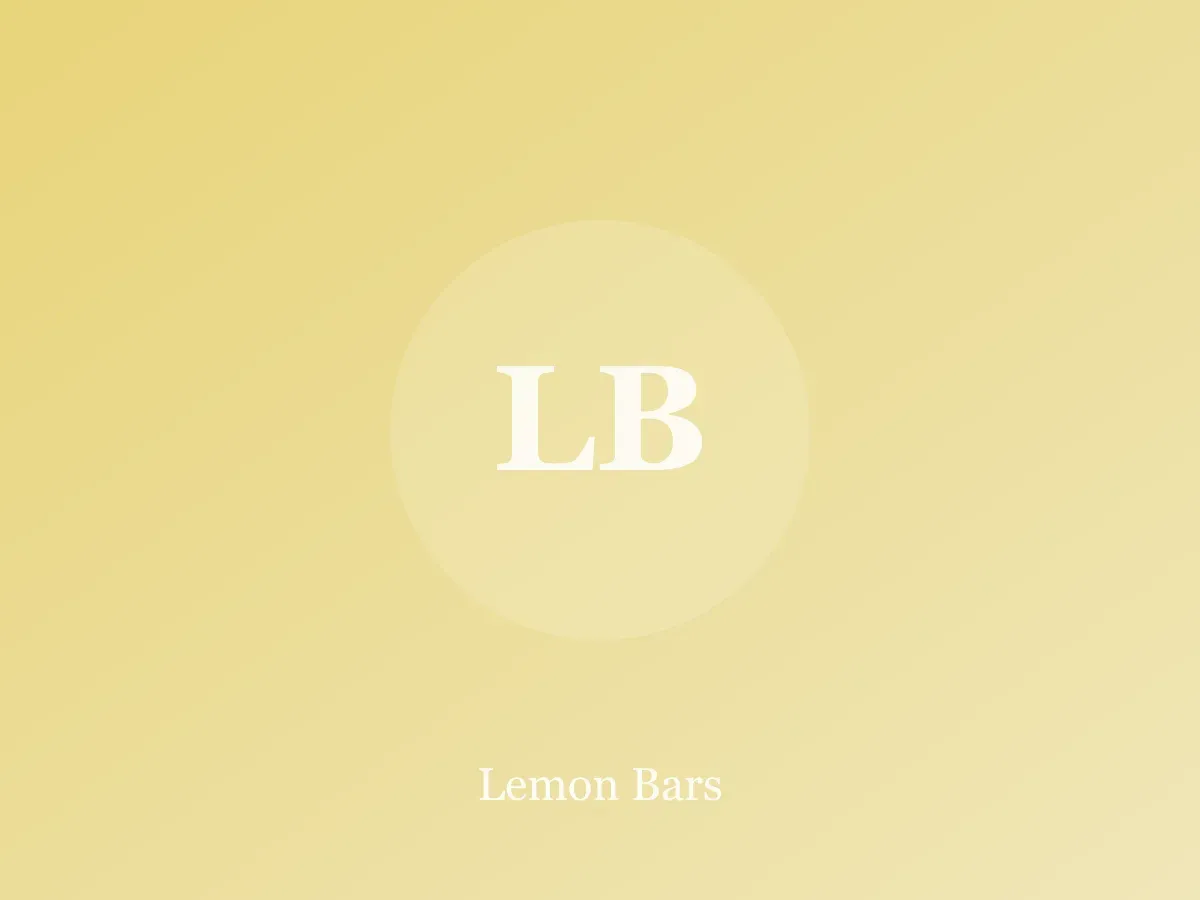 Lemon bars dusted with powdered sugar on parchment paper