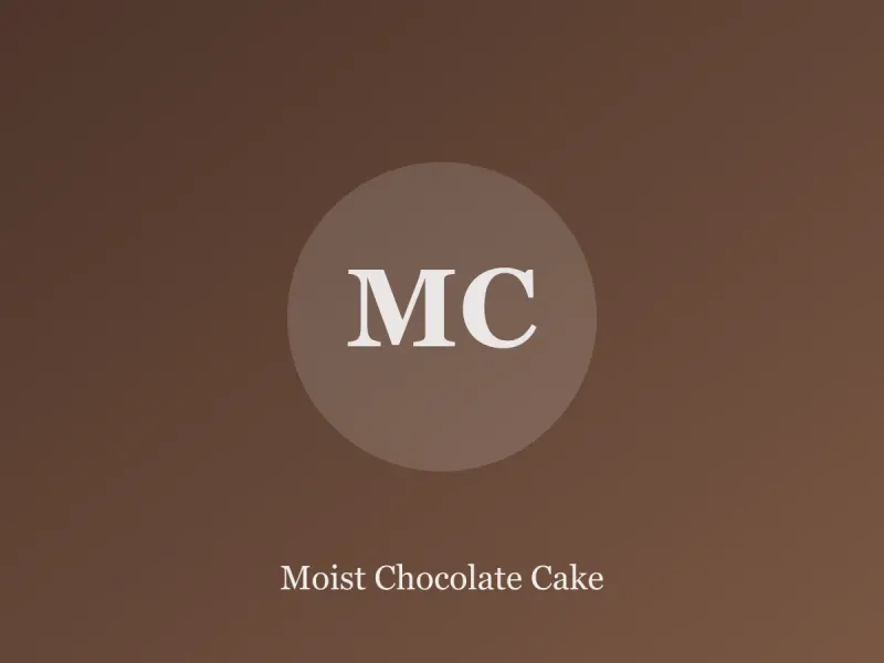 Slice of dark chocolate layer cake with glossy chocolate frosting on a cream plate