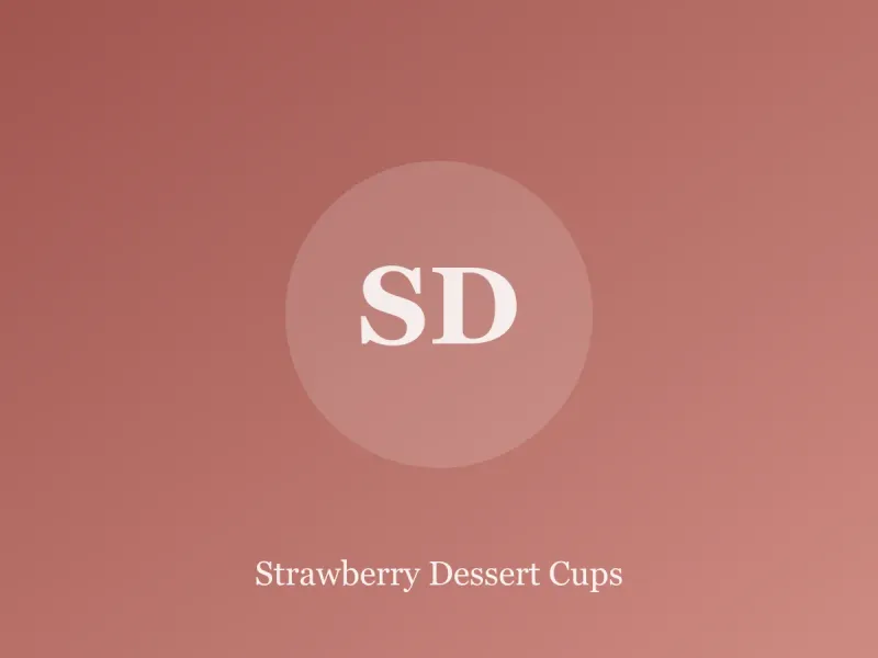 Glass cups layered with strawberries, whipped cream and cookie crumbs