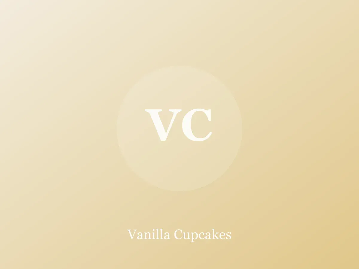 Vanilla cupcakes with swirled buttercream on a cooling rack